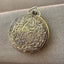 Swiss Made Ornate Pocket Watch β Black & Gold Embellished Face with Floral Scroll Back