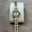 Women's Bulova Gold Watch with White Face – Elegant Simplicity