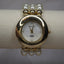 Women's Vanity Fair Gold Watch with White Pearl Bracelet